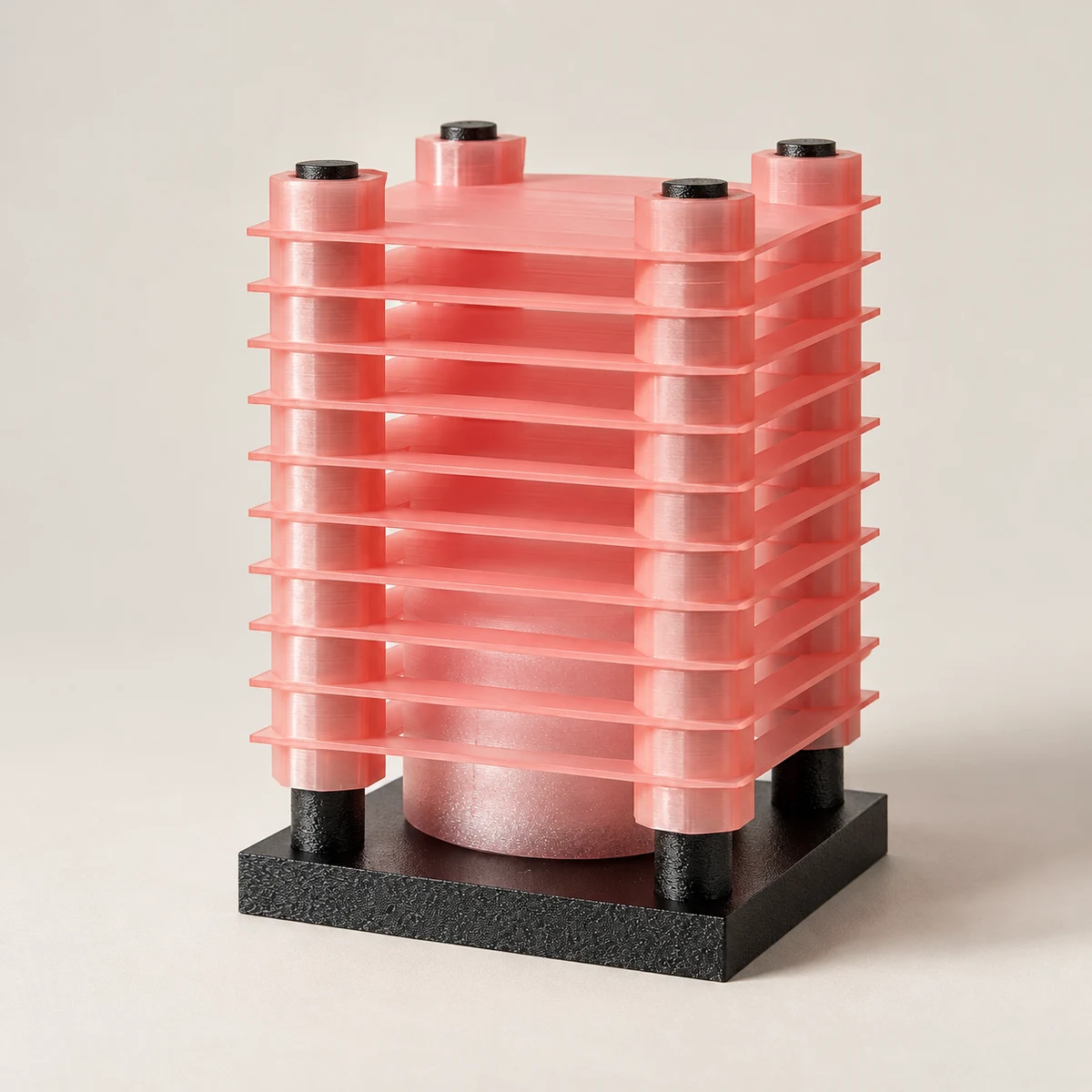 INOKU lamp in metallic pink, with horizontal fins and a dark square base — product visualisation
